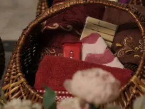 red and maroon bath towel/ hand towel/ pink face hanky/ 5pcs thin wooden cloth clip and a compressed face tissue